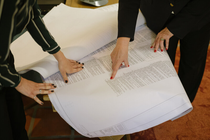 Trusted Legal attorneys reviewing architectural blueprints in Santa Barbara
